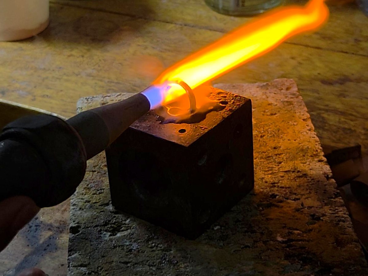 A Kingdom Emeralds goldsmith setting an emerald